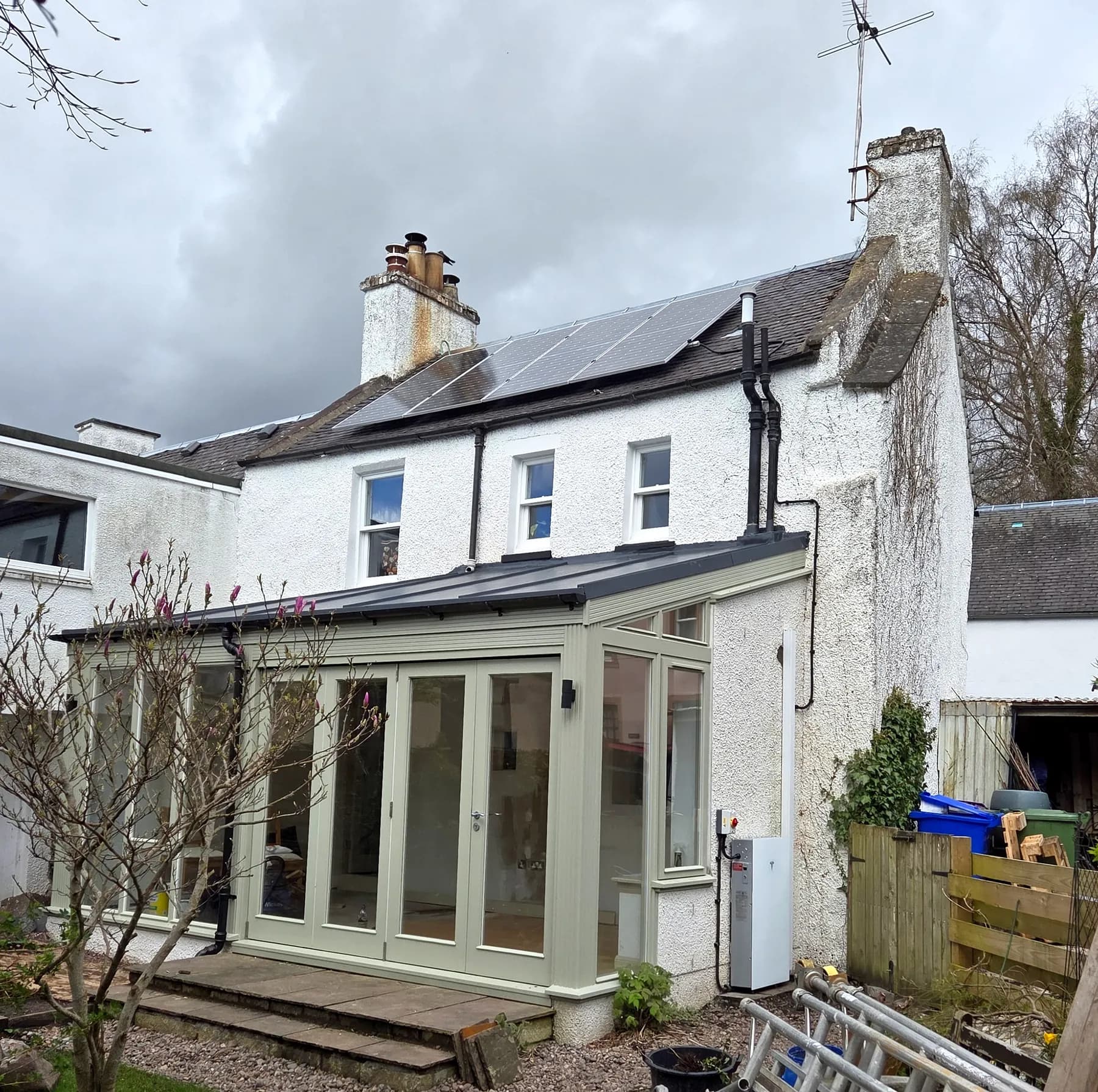 Solar panels installed on the natural slate roof of a traditional home in Dunblane