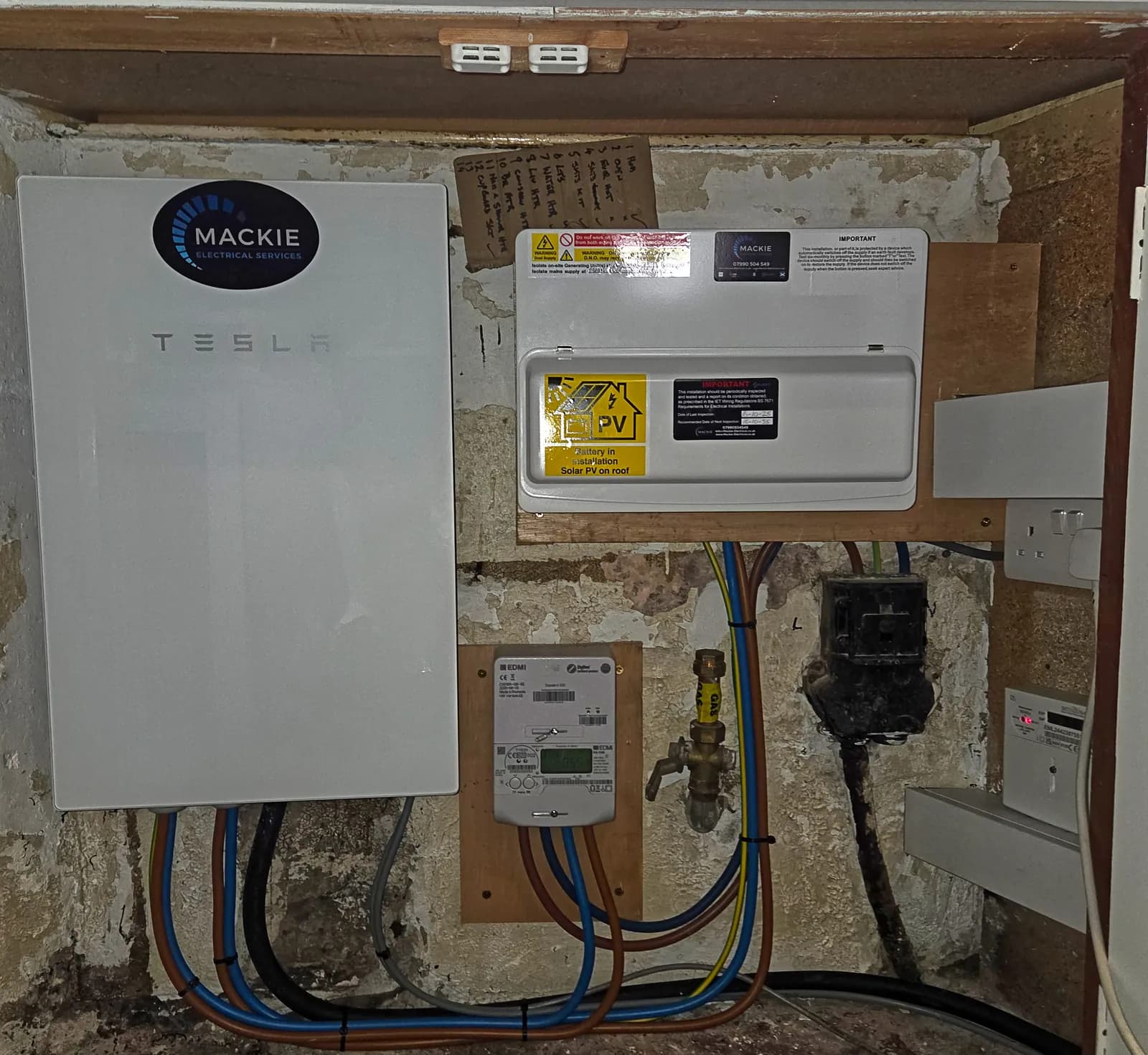 Tesla gateway and labelled solar PV consumer unit installed by Mackie Electrical Services in Dunblane